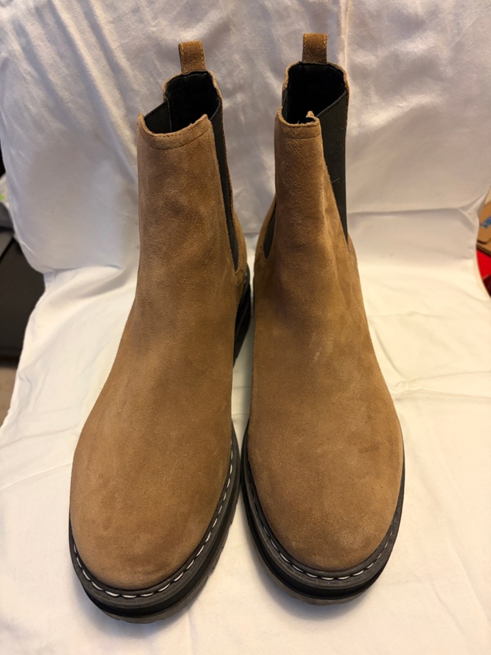 Tan suede Chelsea boots.
